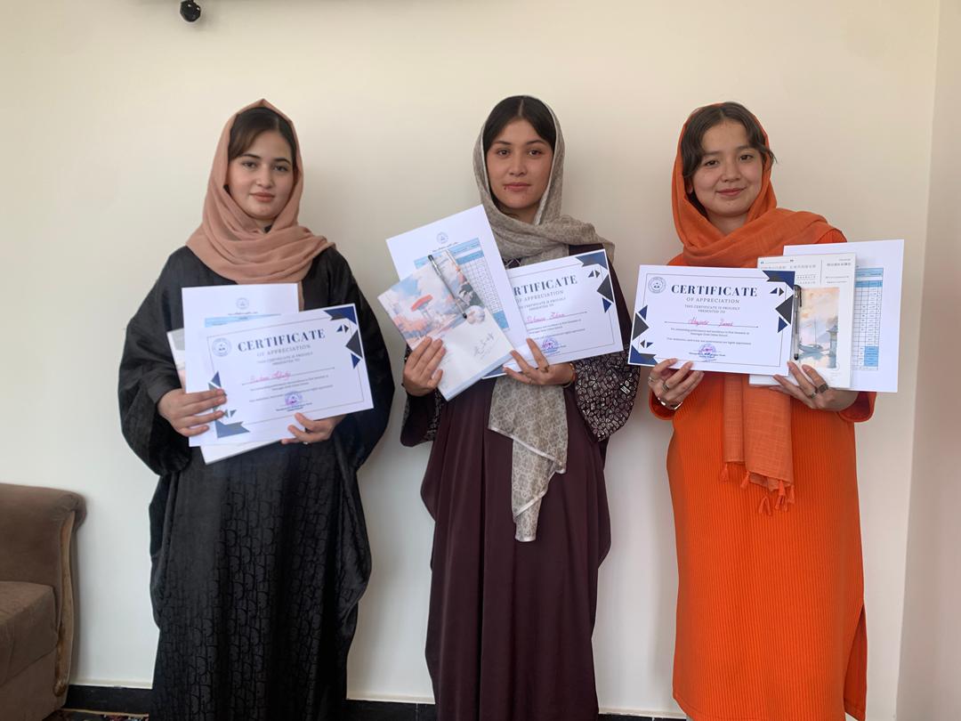 Girls receiving awards and certificates